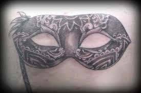 Signification de tatouage de masque de mascarade 34